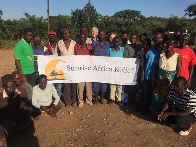 Makala village with Sunrise Africa Relief banner
