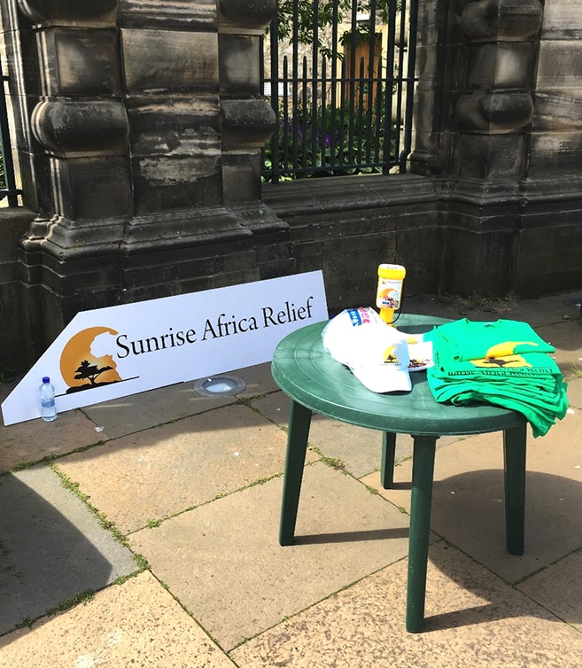 SAR table with banner and charity t-shirts