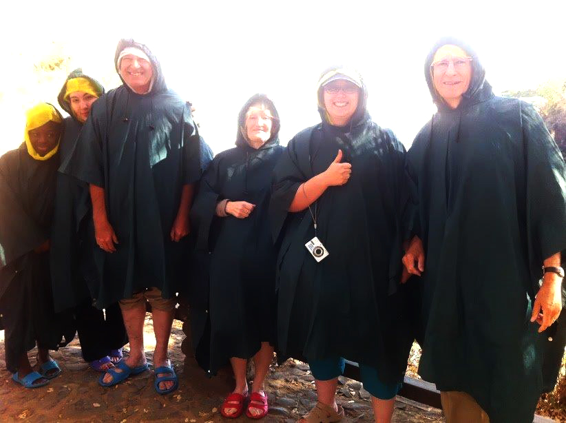 Our travelling group beside Victoria Falls in raincoats